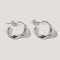 Pair of silver twisted hoop earrings with a polished finish on a white background