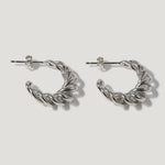 Silver twisted hoop earrings with post backs on white background