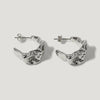 Pair of chunky silver hoop earrings with a sculpted, organic textured design on white background