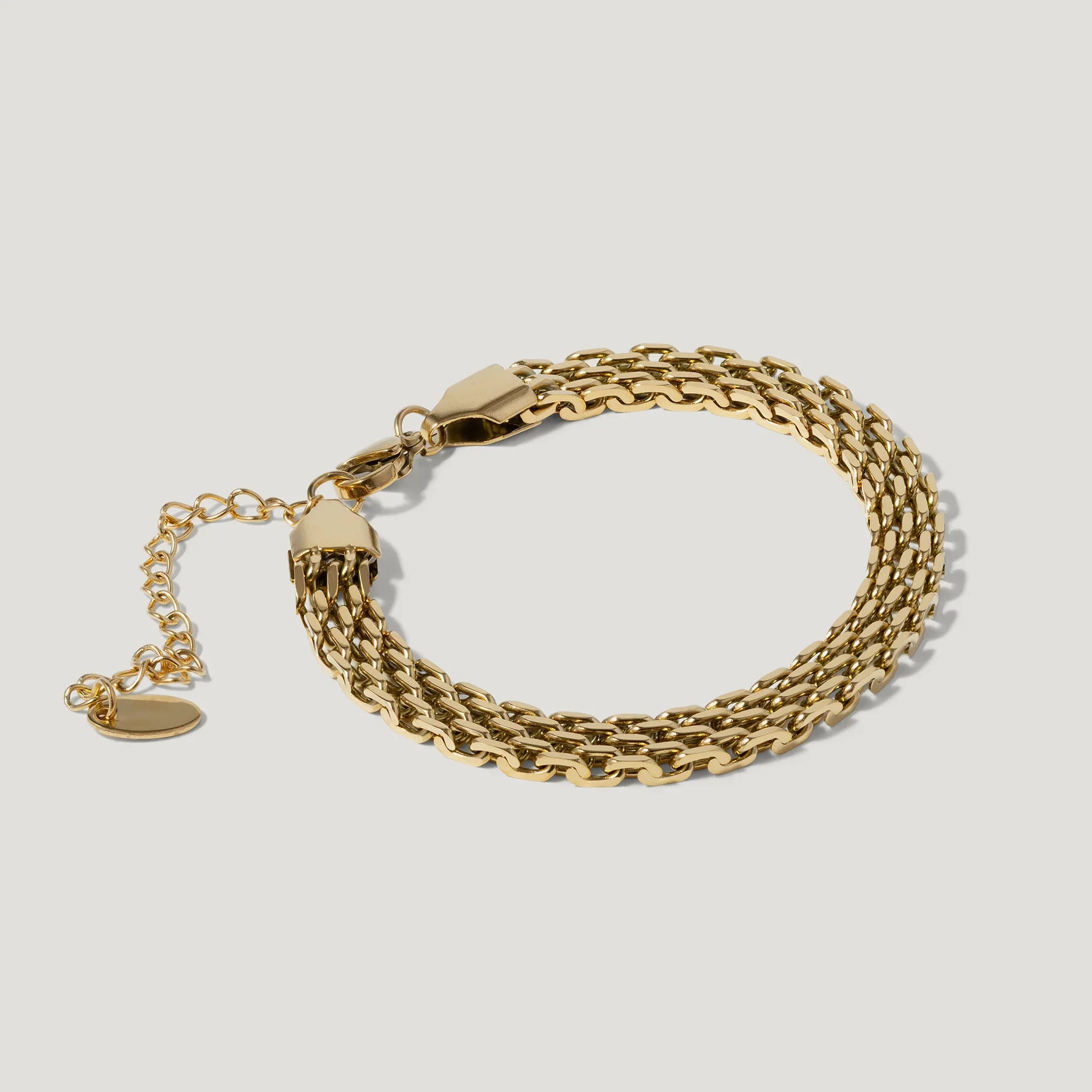 Elegant gold chain bracelet with adjustable clasp on a white background