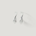 Pair of twisted silver hoop earrings on a plain white background