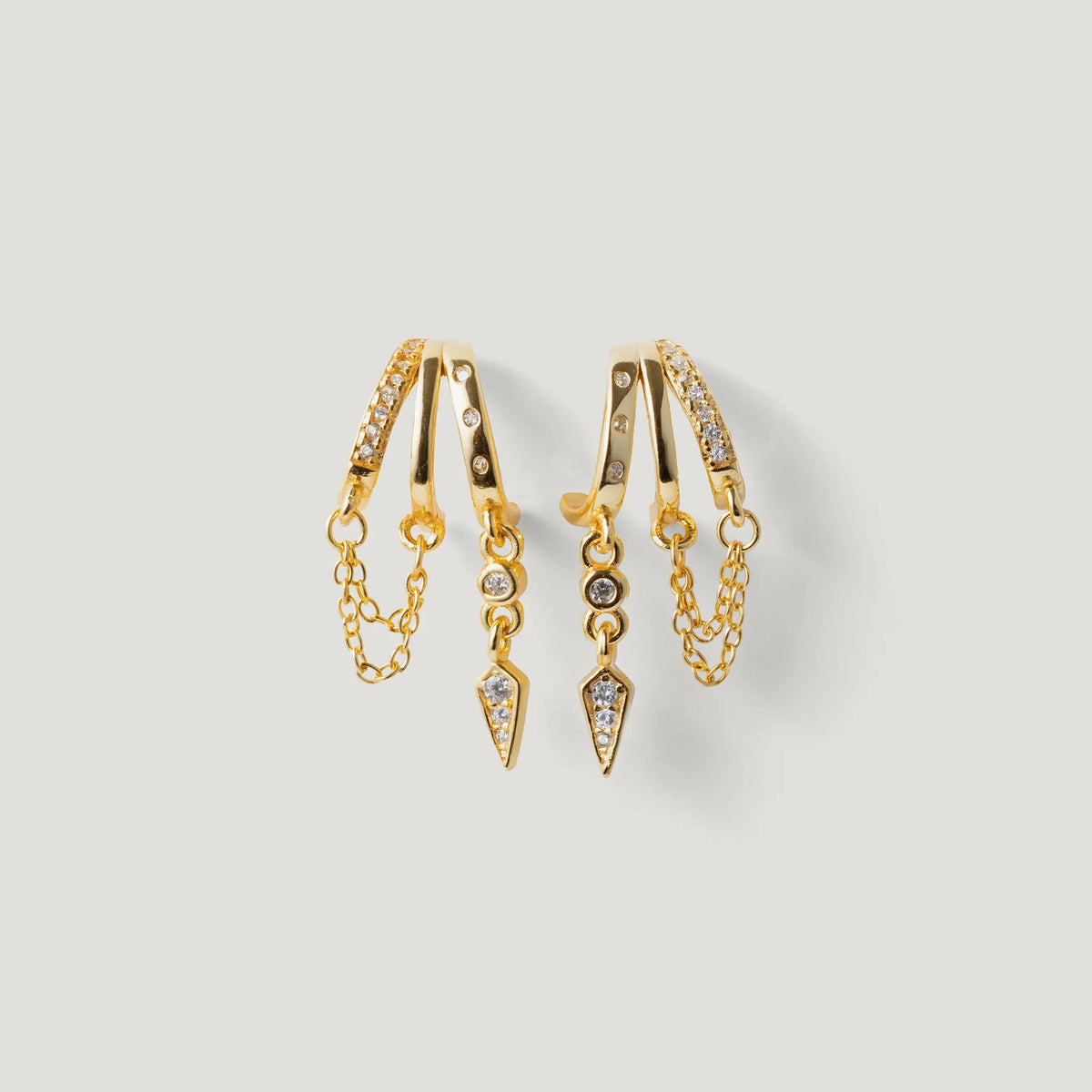 Gold hoop earrings with crystal pavé, chain accents, and geometric dangle charms