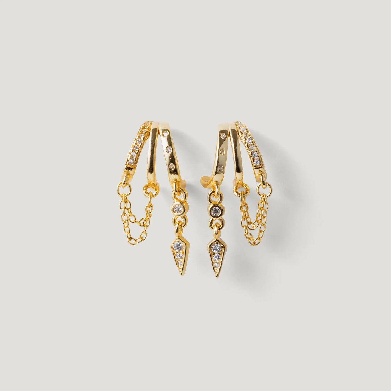 Gold hoop earrings with crystal pavé, chain accents, and geometric dangle charms