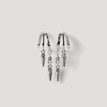 Pair of silver hoop earrings with hanging spike charms and small crystal accents