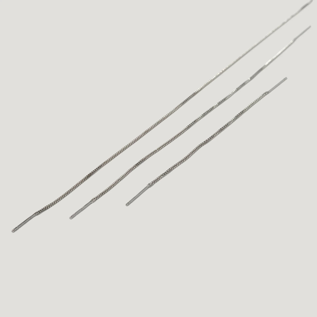 Three delicate silver threader chains for earrings on a white background