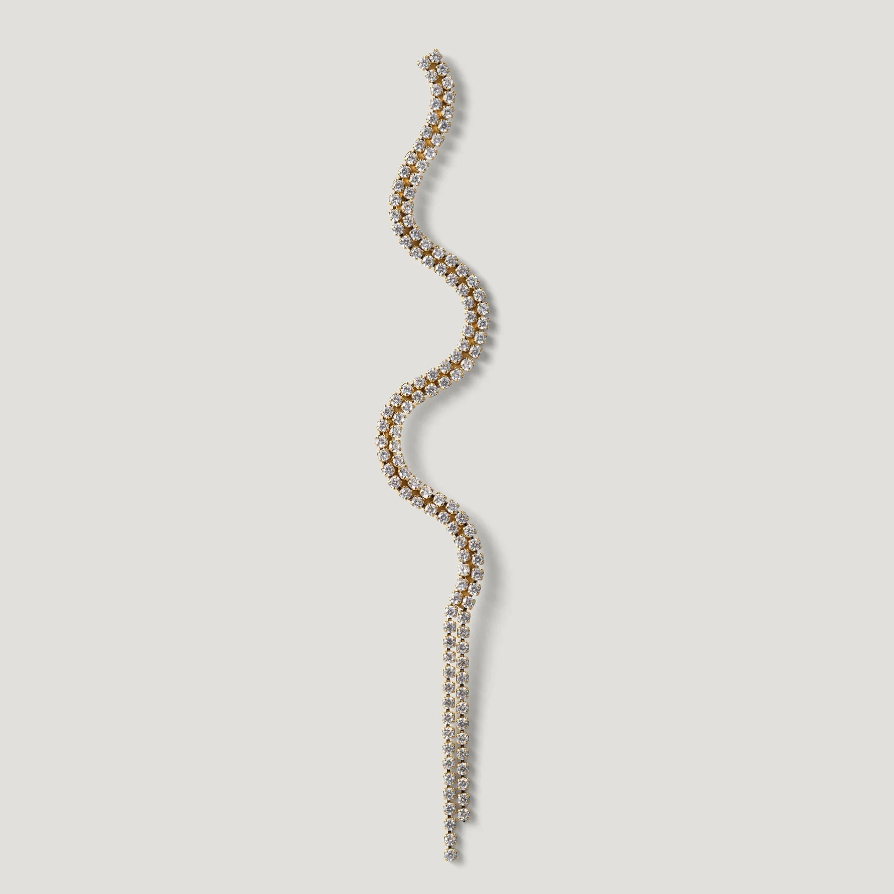 Curved gold and diamond tennis bracelet on a light background, elegant jewelry design