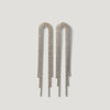 Long crystal fringe drop earrings with gold-tone setting on white background