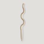 Gold wavy diamond stud earring with curved shape on white background