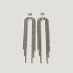 Long silver chain drop earrings with three-tiered geometric strands on white background