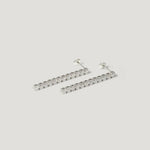Silver bar stud earrings with clear round gemstones on white background